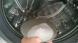 pouring the salt on top of the dye in the machine