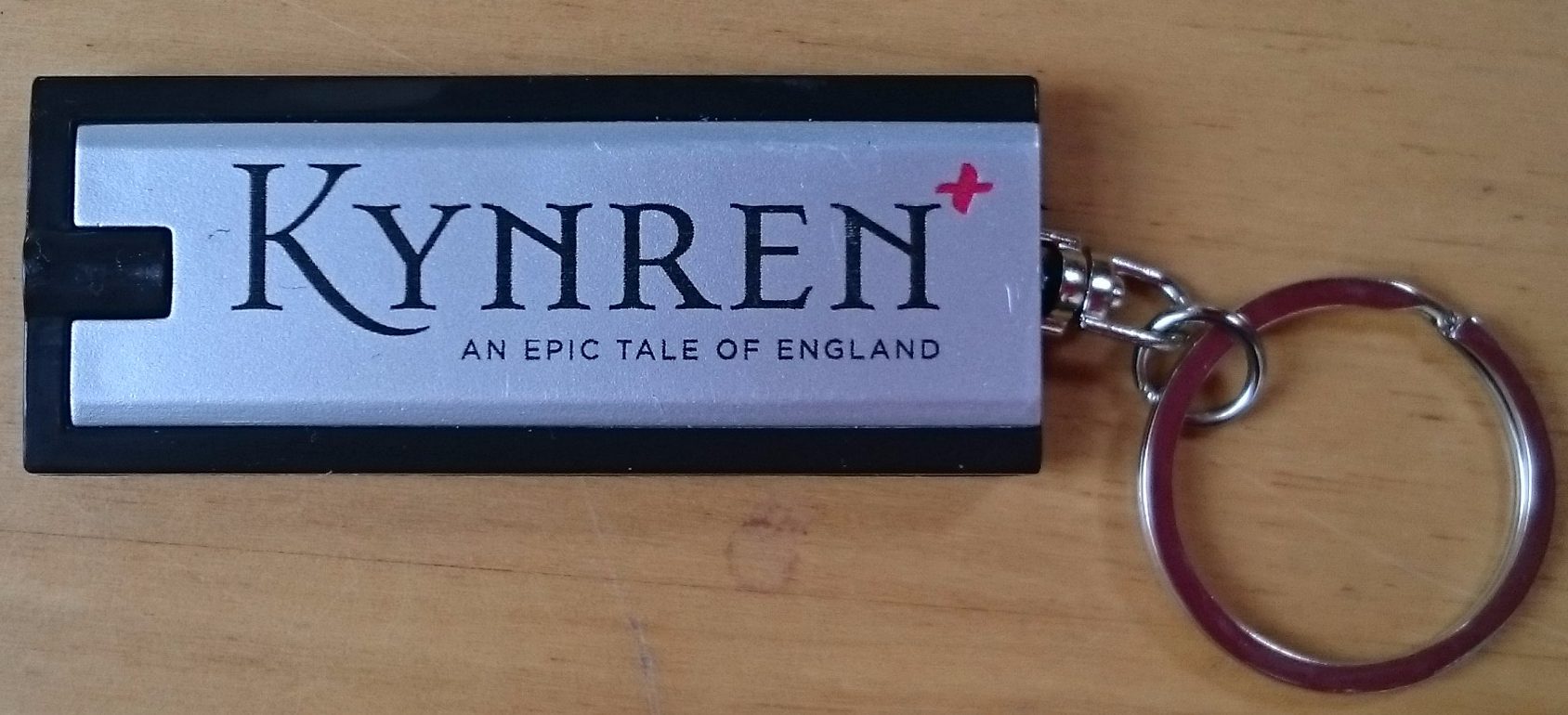 small torch printed with the word 'Kynren'