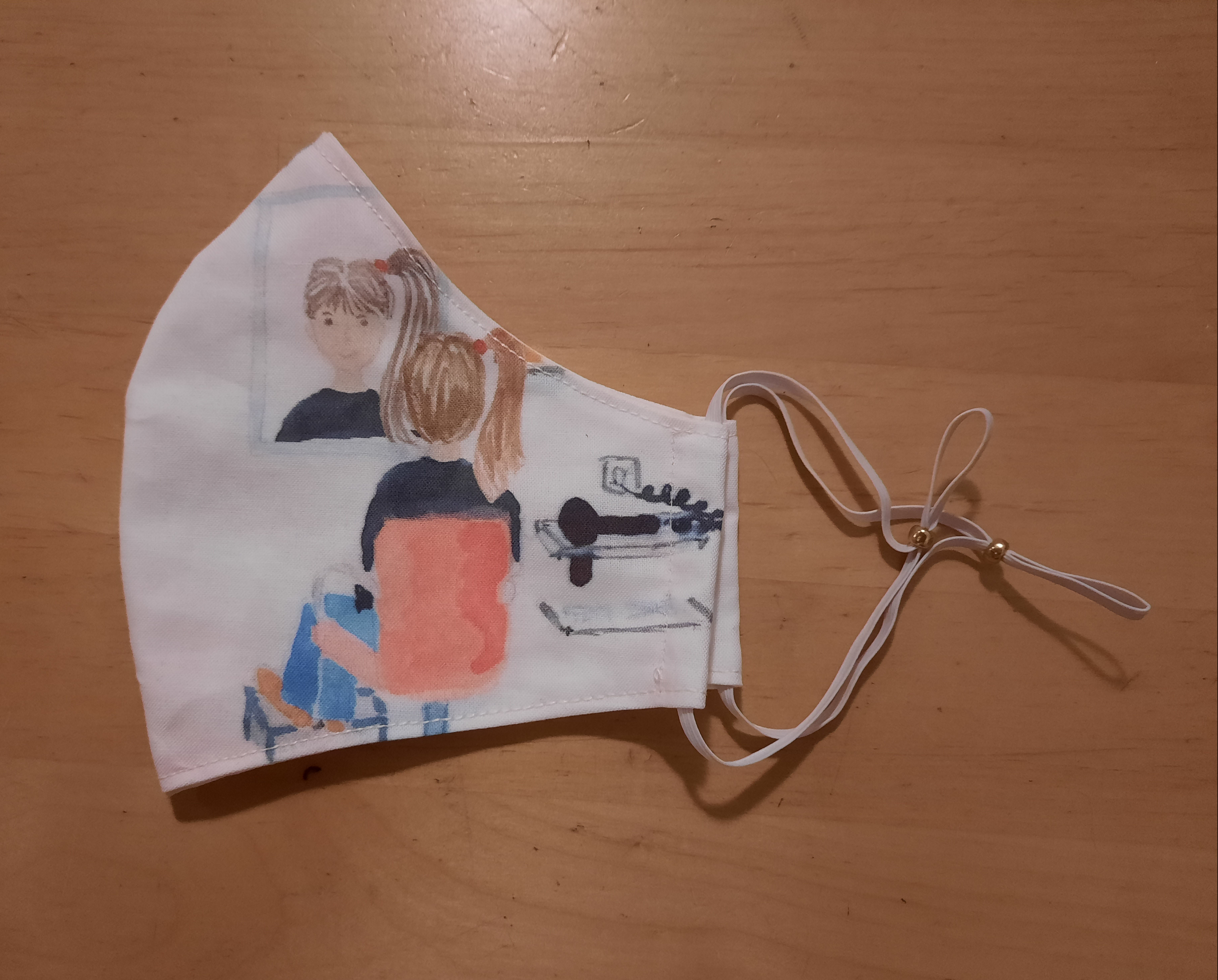 The right hand side of the finished mask showing a girl in a hairdresser's chair