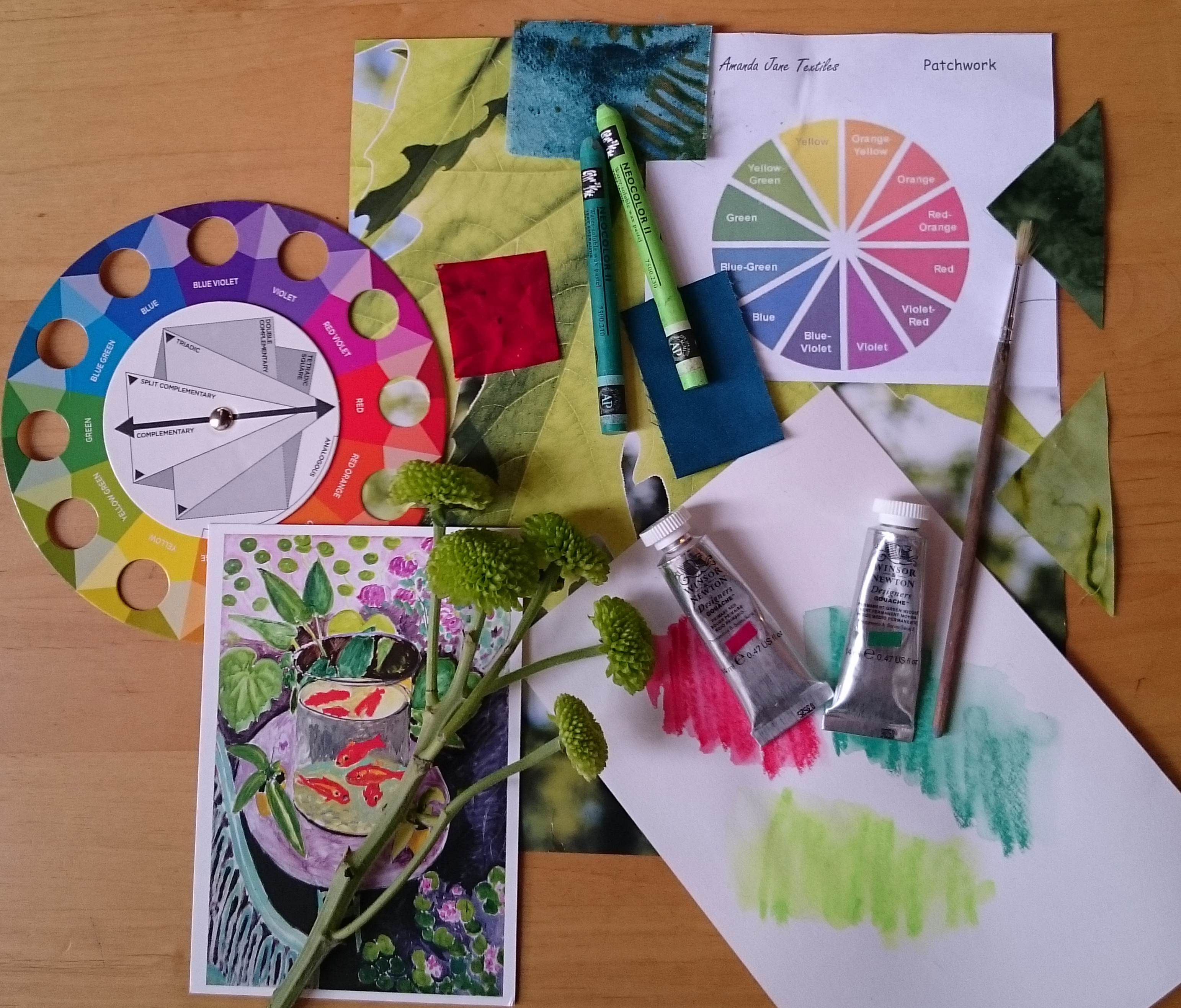 art materials, a colour wheel, and inspirational artwork used in Amanda's 'Surprised by Colour' workshop
