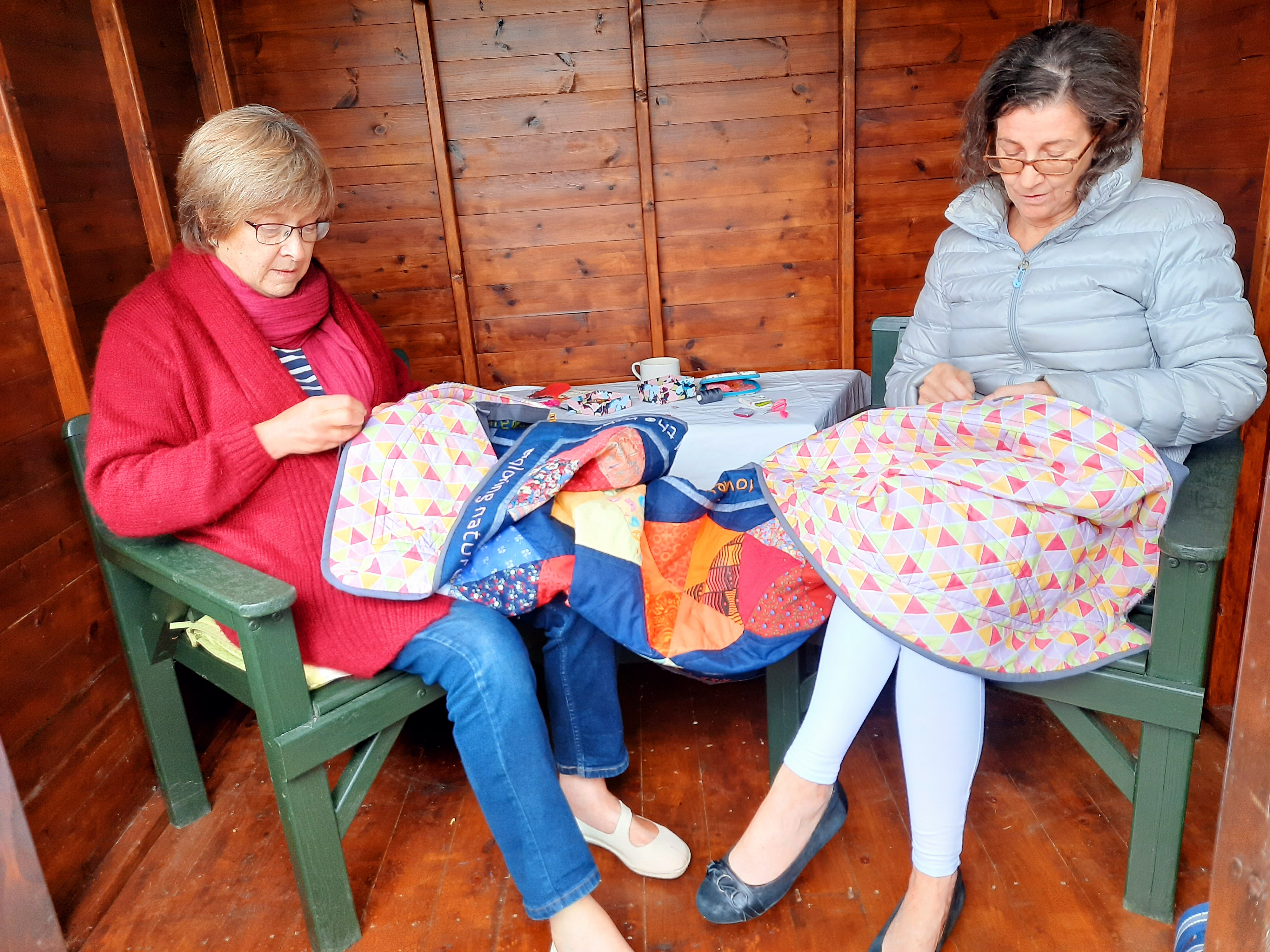 'Threaded friendship' quilt by Felicity Higginson, Alison Moore and Amanda Ogden, stitching the border
