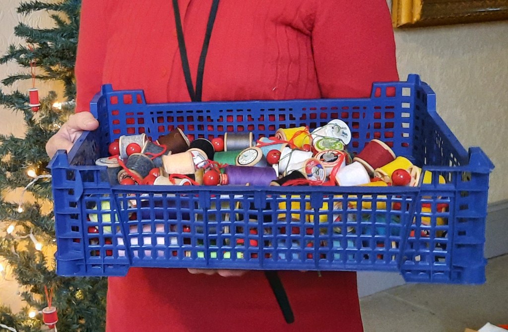 a tray of cotton-reel decorations