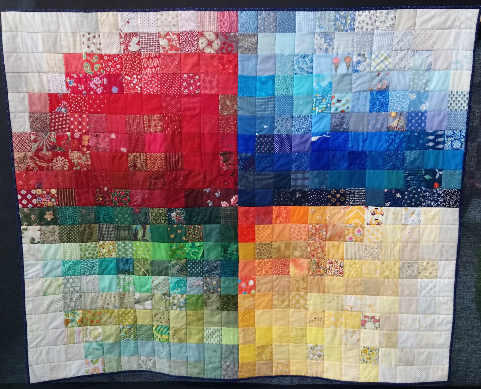 A quilt with four coloured quarters called Colour Mosaic by Amanda Jane Textiles