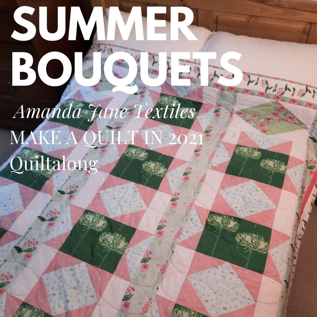 The 'Summer Bouquets' quilt on a bed
