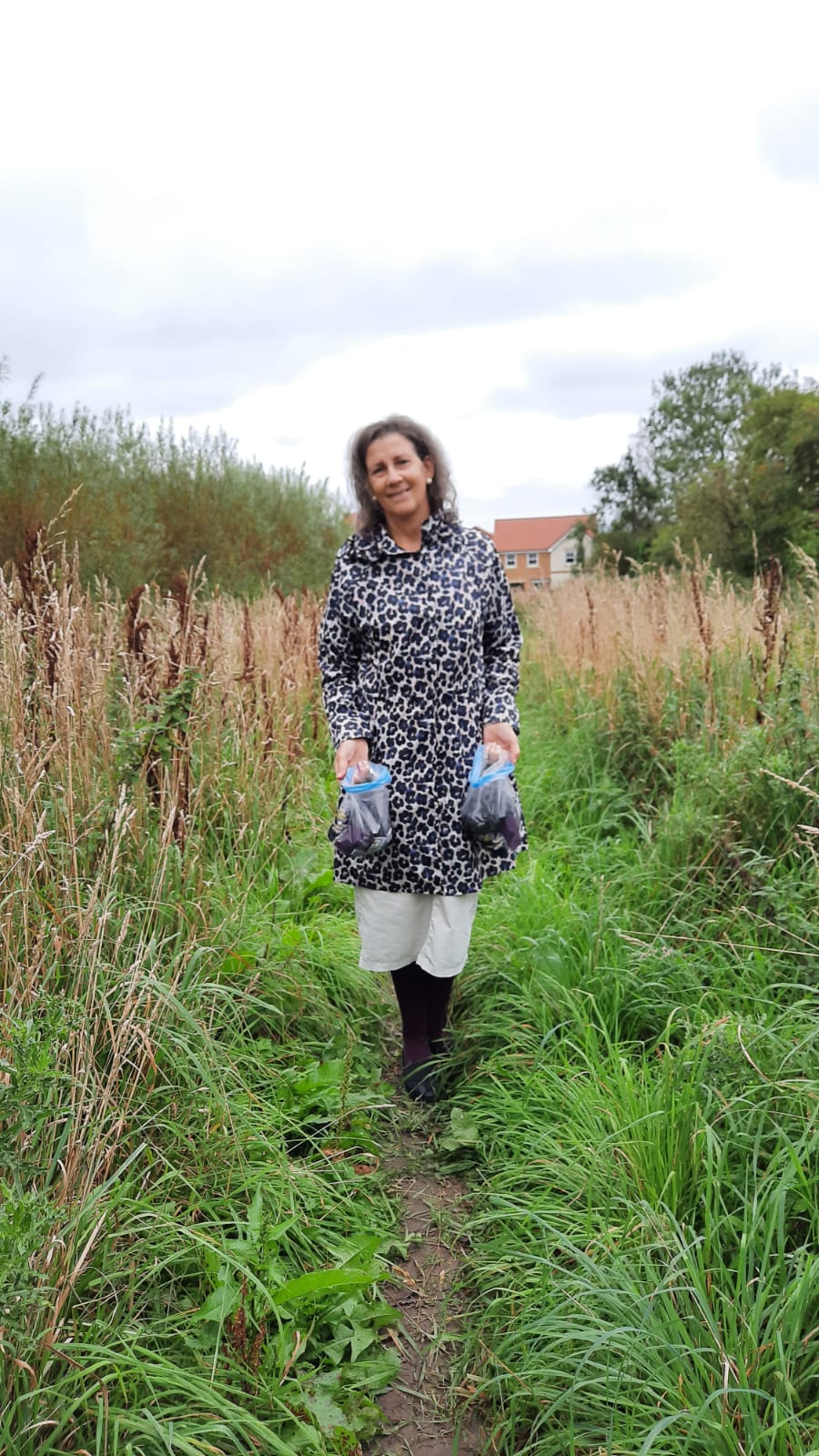 Amanda Ogden gathering blackberries