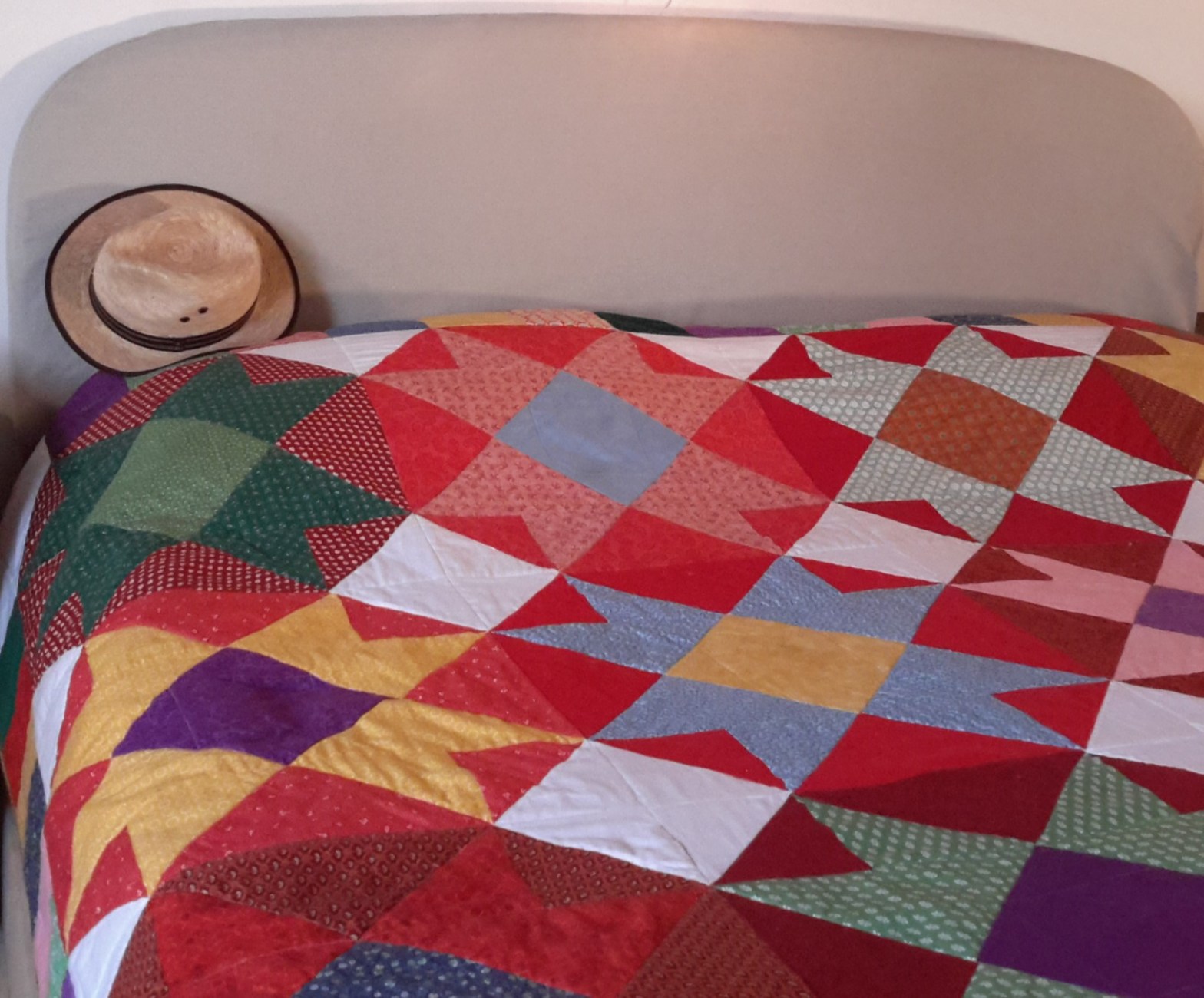 a patchwork quilt in vibrant colours, inspired by colours in Mexico