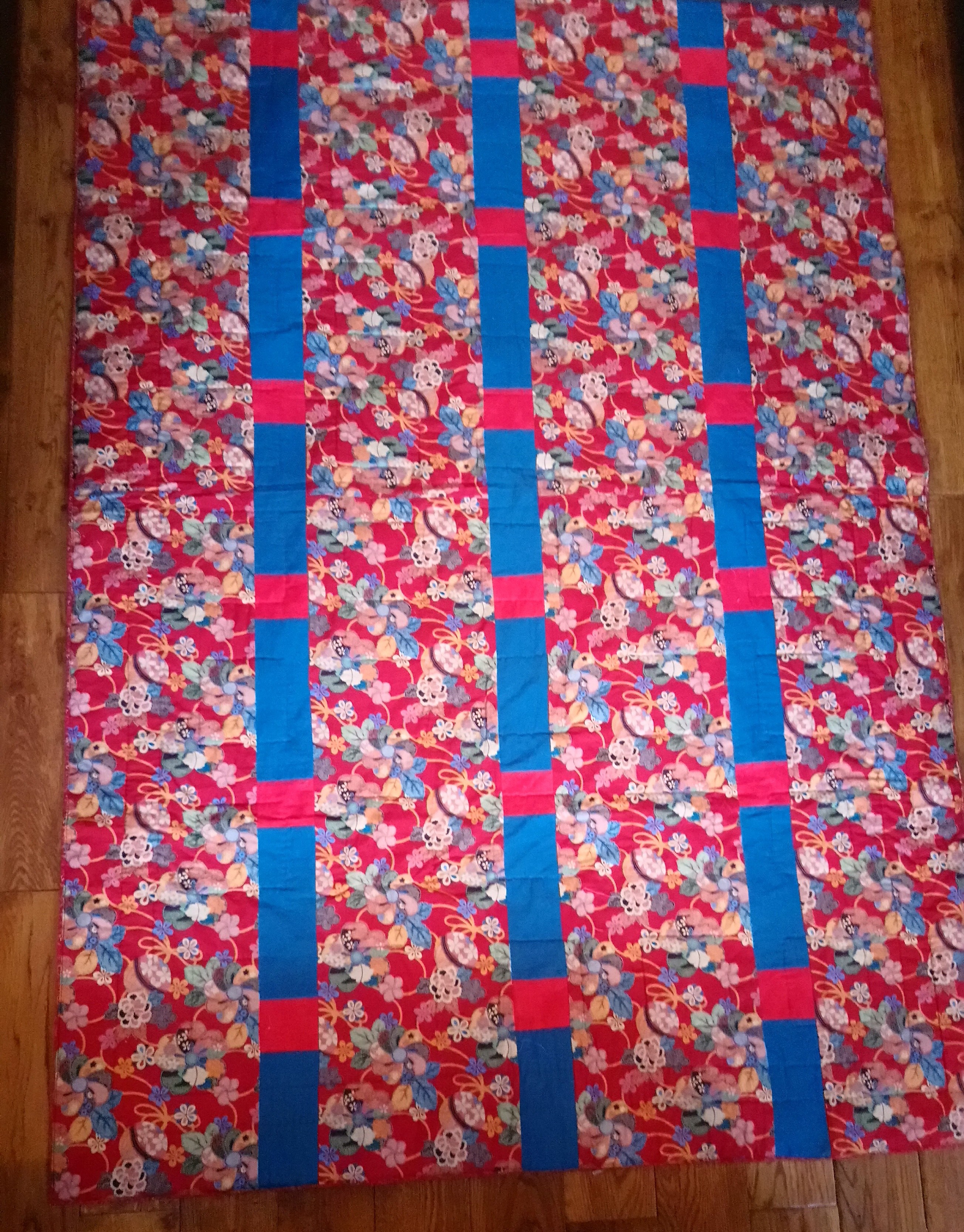 Photo of a quilt to show how inserting strips adds to the width