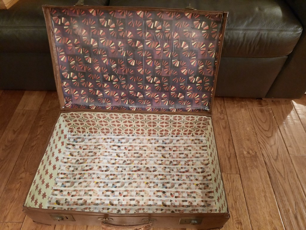 Updating a vintage suitcase with a paper lining