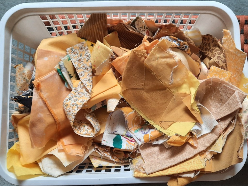 The basket of small yellow scraps