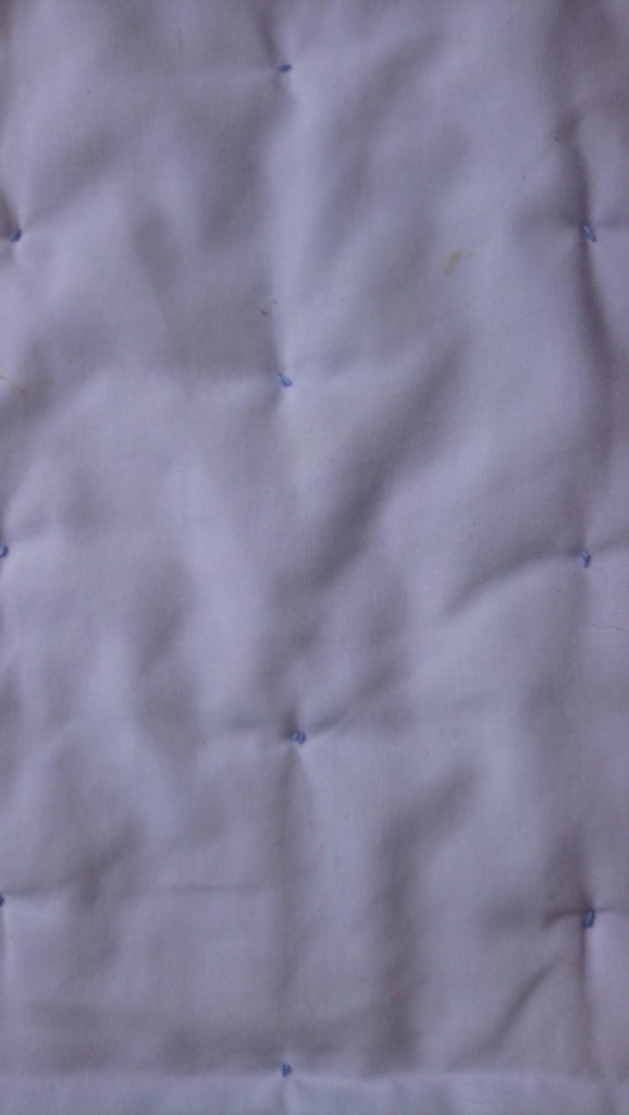 example of 'tied quilting' seen from the back