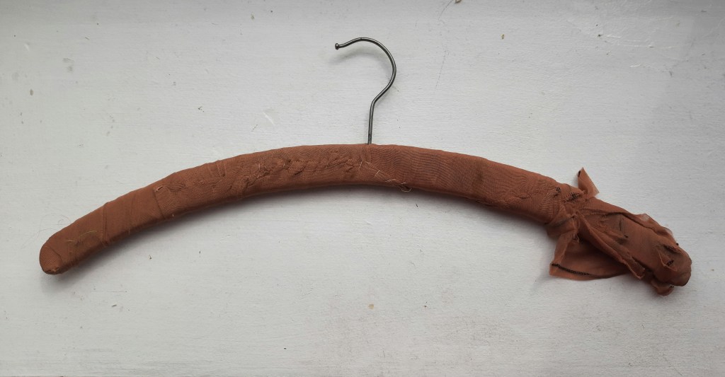 stockings used to bind a vintage coathanger