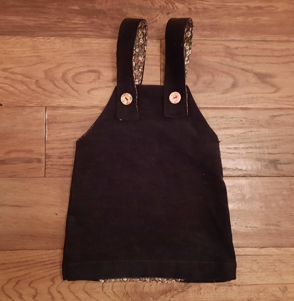 Toddler pinafore from a recycled skirt