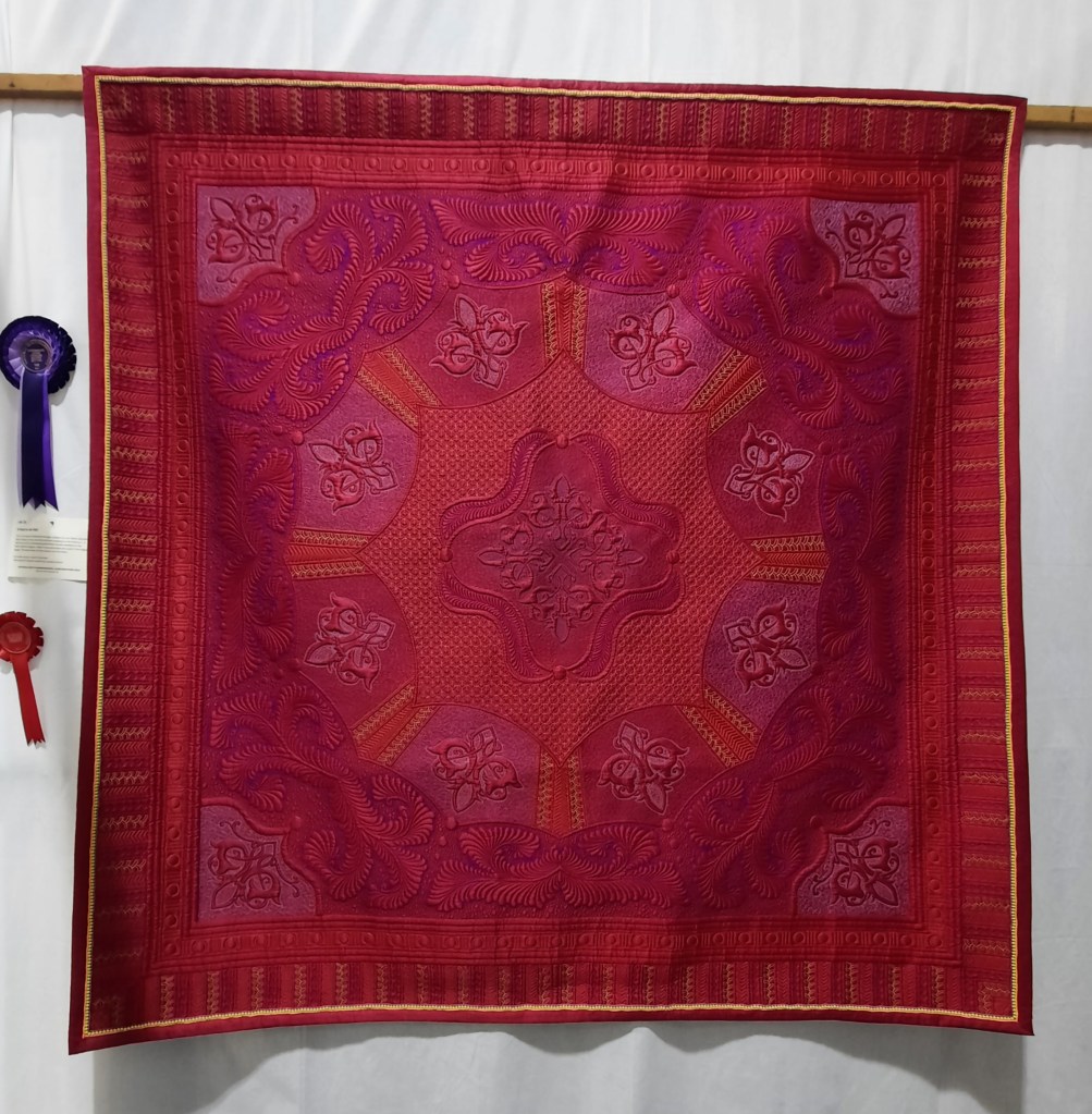 'It Had to be Red' wholecloth quilt by Lynda Jackson