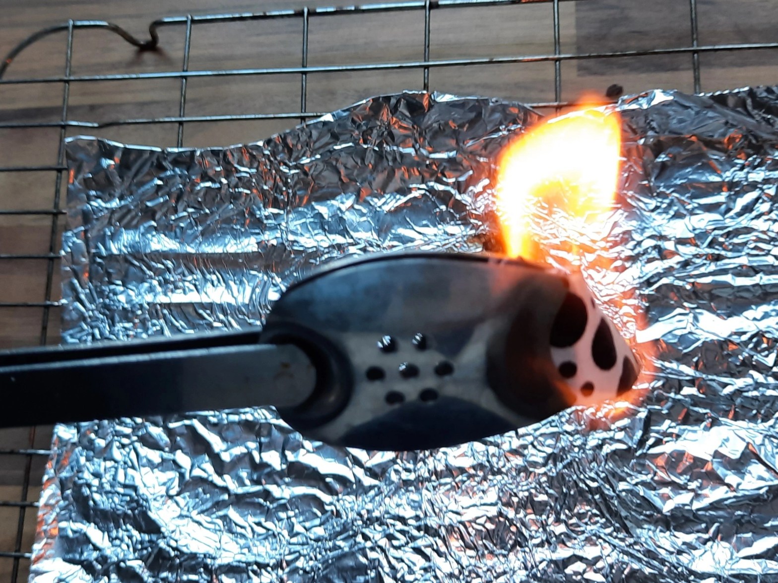 cotton fabric being subjected to a burn test