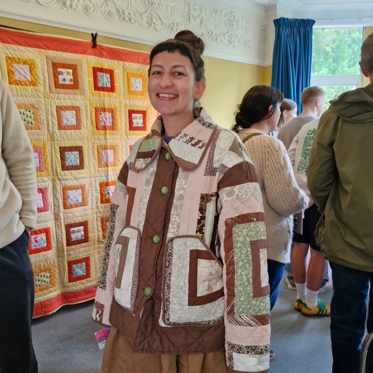 Sascha wearing her quilted jacket  at the Green Walk Open Houses Arts & Crafts Event 2025, Manchester