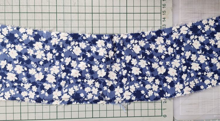 fabric piece acting as a backing for the patchwork