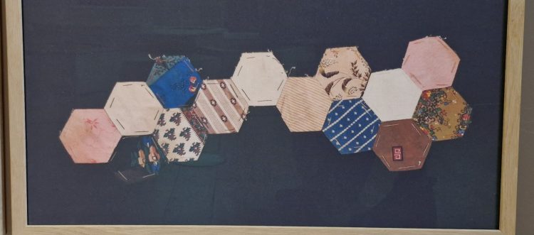 Hand-stitched patchwork over papers, from the Mary Greg collection in 'Things of the Least' exhibition at Manchester Art Gallery