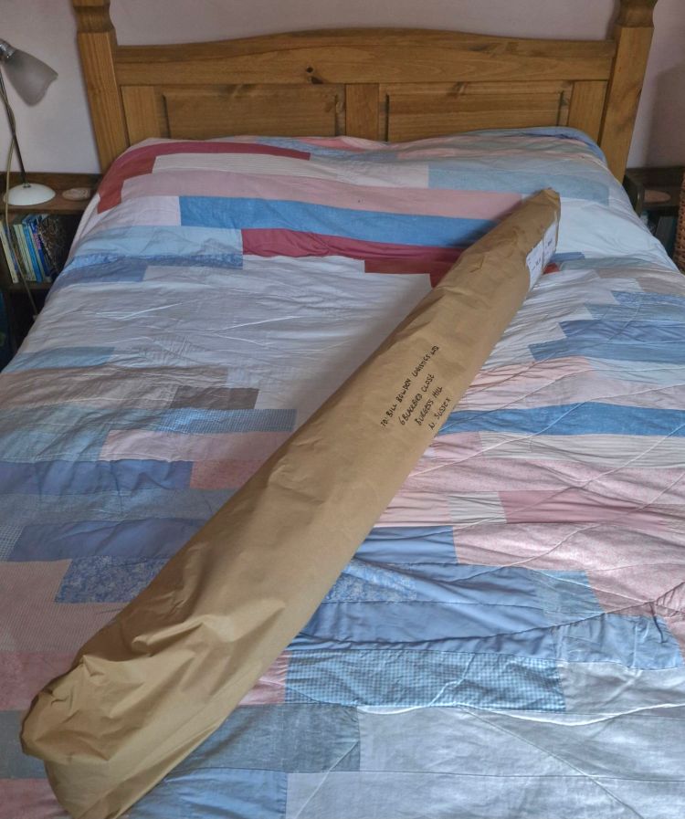 Wrapped parcel containing quilts for the Festival of Quilts