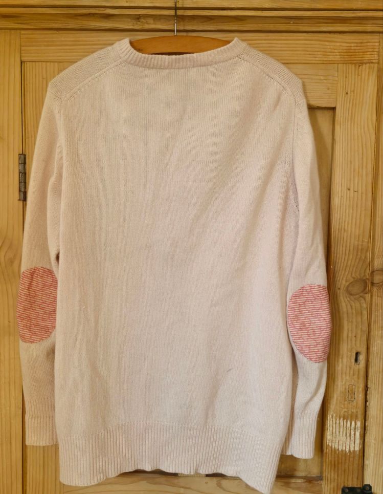 Patched sleeves on a cashmere cardigan